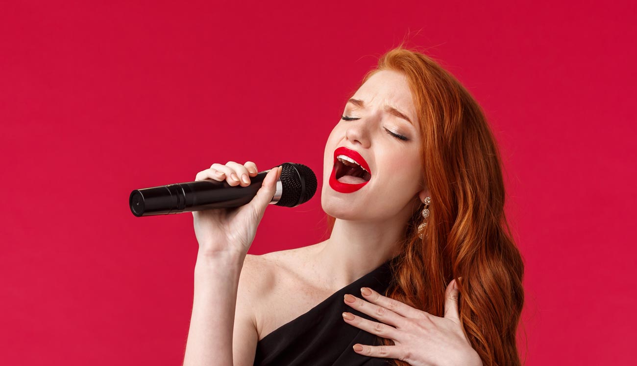 Lady singer with microphone in hand singing