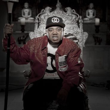 Rapper Twista on a chair with red jacket