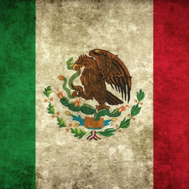 Image of Mexican flag green white and red with eagle and snake